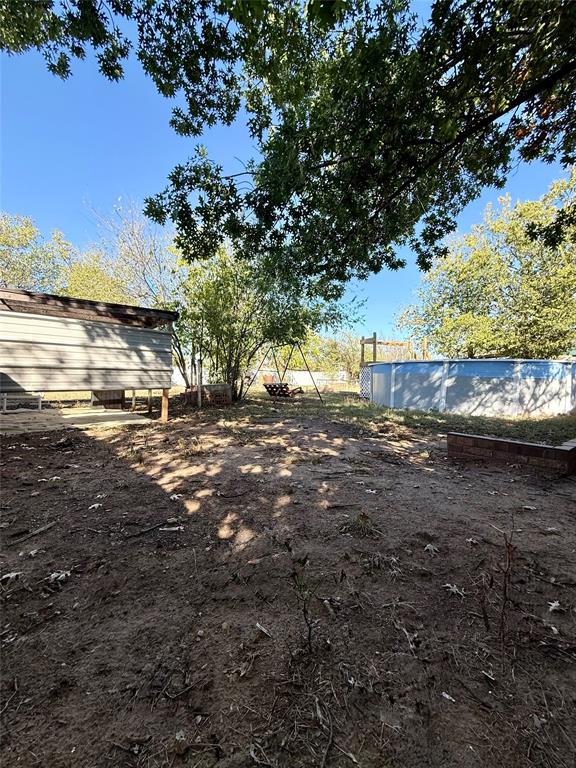704 Post Street Coleman, TX 76834 - Photo 23 of 40 a view of a yard with an outdoor space