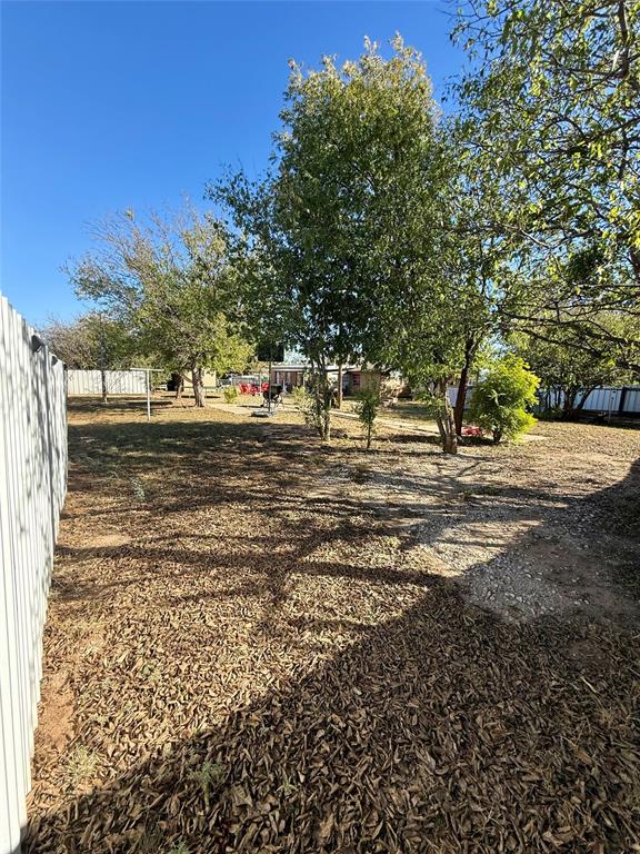 704 Post Street Coleman, TX 76834 - Photo 25 of 40 a backyard of a house with lots of green space