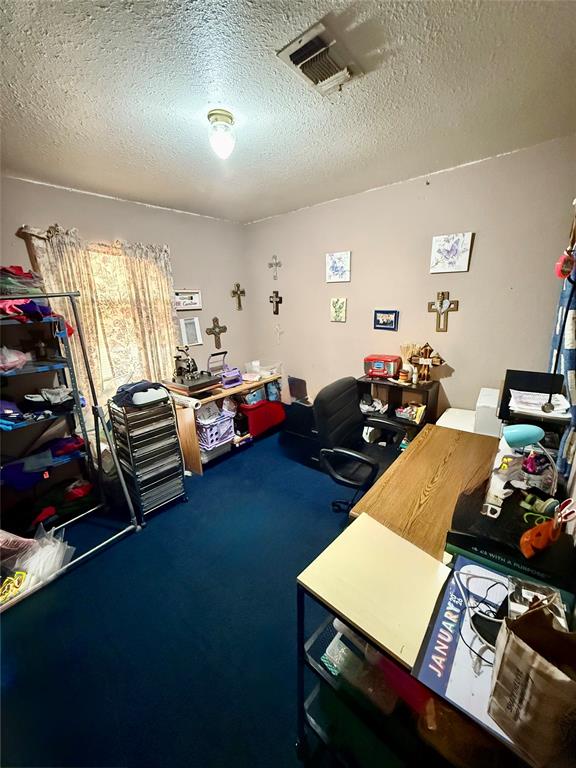 704 Post Street Coleman, TX 76834 - Photo 10 of 40 a room with furniture pool table gym equipment and a window