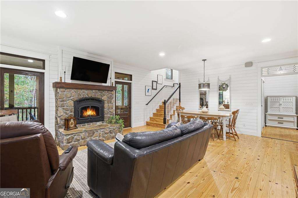 2197 Damascus Road Ball Ground, GA 30107 - Photo 13 of 39 a living room with furniture a flat screen tv and a fireplace