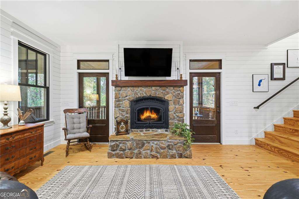 2197 Damascus Road Ball Ground, GA 30107 - Photo 14 of 39 a living room with furniture and a fireplace
