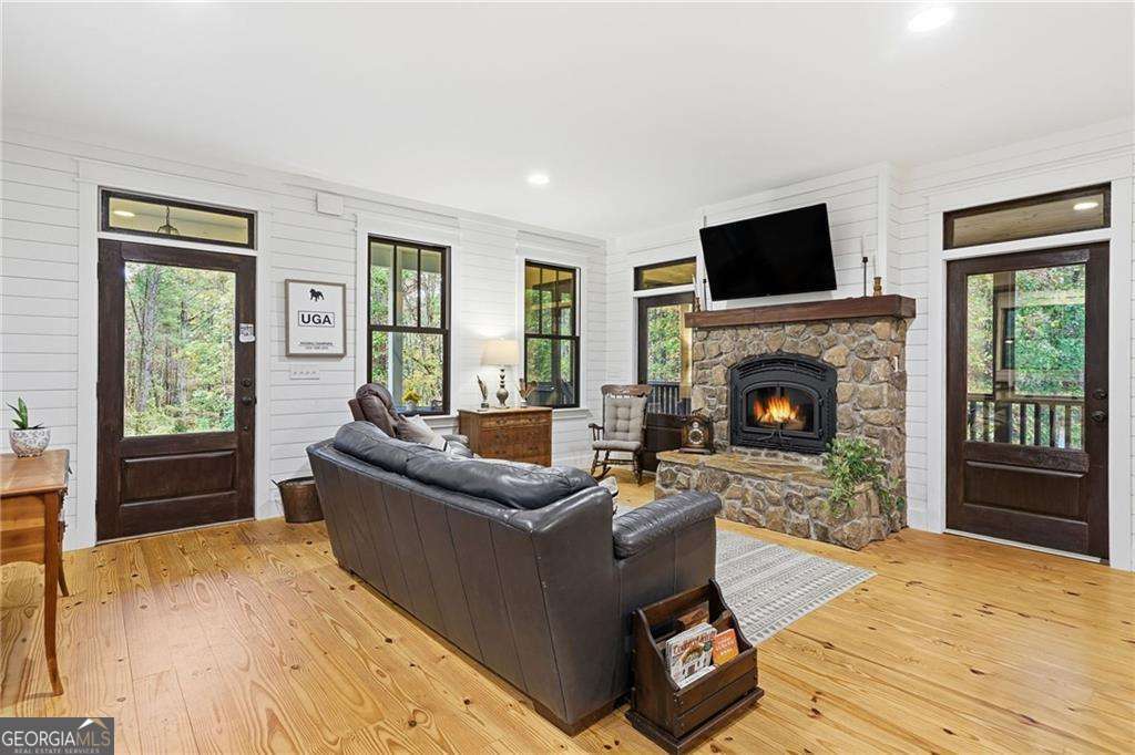 2197 Damascus Road Ball Ground, GA 30107 - Photo 15 of 39 a living room with furniture and a fireplace