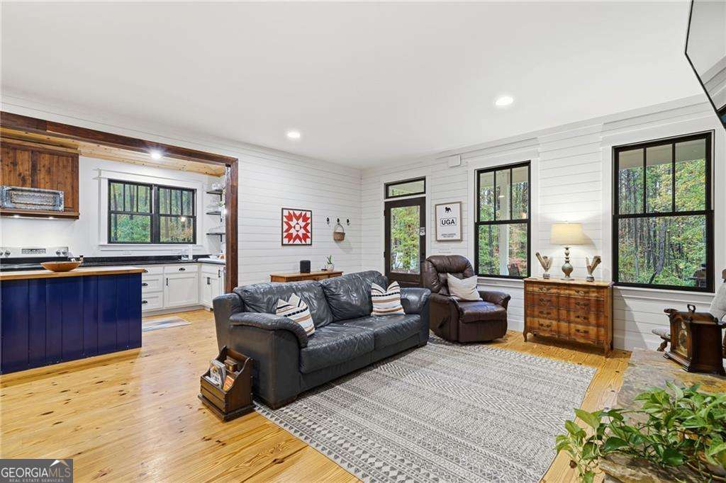 2197 Damascus Road Ball Ground, GA 30107 - Photo 16 of 39 a living room with furniture and a large window