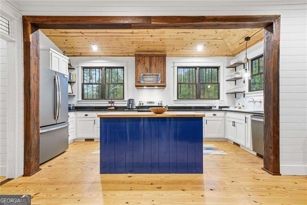 2197 Damascus Road Ball Ground, GA 30107 - Photo 19 of 39 a kitchen with stainless steel appliances granite countertop a refrigerator and a sink