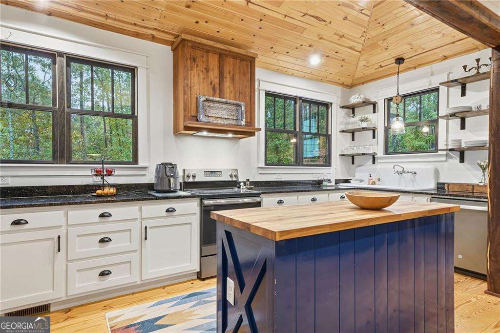 2197 Damascus Road Ball Ground, GA 30107 - Photo 20 of 39 a kitchen with a sink stove and cabinets