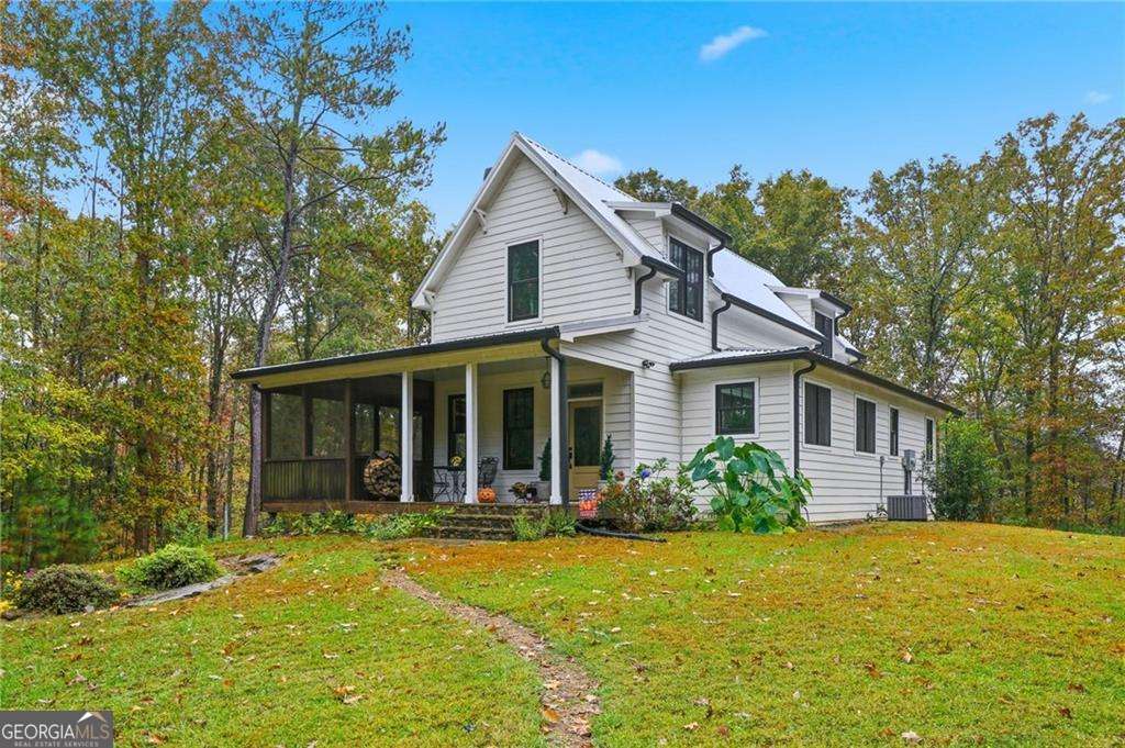 2197 Damascus Road Ball Ground, GA 30107 - Photo 2 of 39 front view of a house with a yard