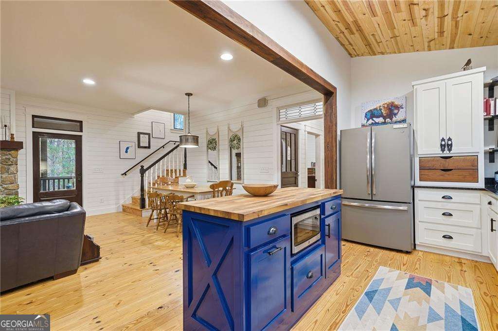 2197 Damascus Road Ball Ground, GA 30107 - Photo 22 of 39 a kitchen with stainless steel appliances granite countertop a sink stove and refrigerator