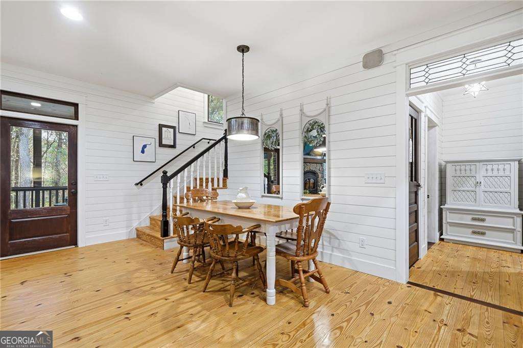 2197 Damascus Road Ball Ground, GA 30107 - Photo 23 of 39 a view of a dining room with furniture and wooden floor