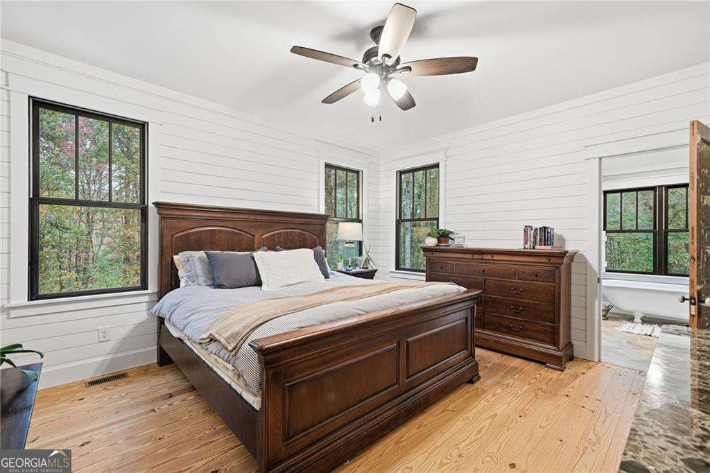 2197 Damascus Road Ball Ground, GA 30107 - Photo 24 of 39 a bedroom with a large bed and a window