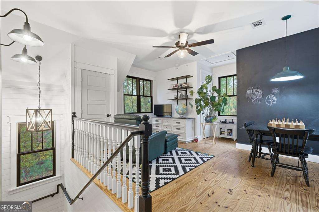 2197 Damascus Road Ball Ground, GA 30107 - Photo 31 of 39 a view of a livingroom with furniture window and wooden floor