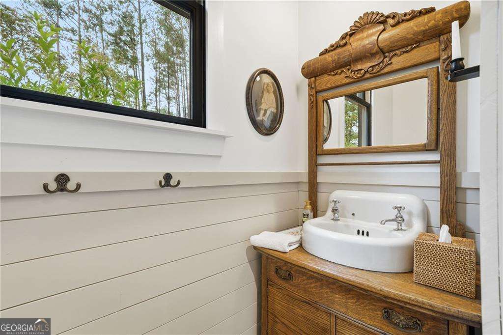 2197 Damascus Road Ball Ground, GA 30107 - Photo 38 of 39 a bathroom with a sink and a mirror