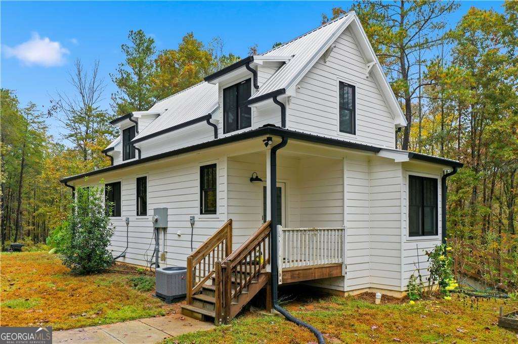 2197 Damascus Road Ball Ground, GA 30107 - Photo 4 of 39 a view of a house with a yard
