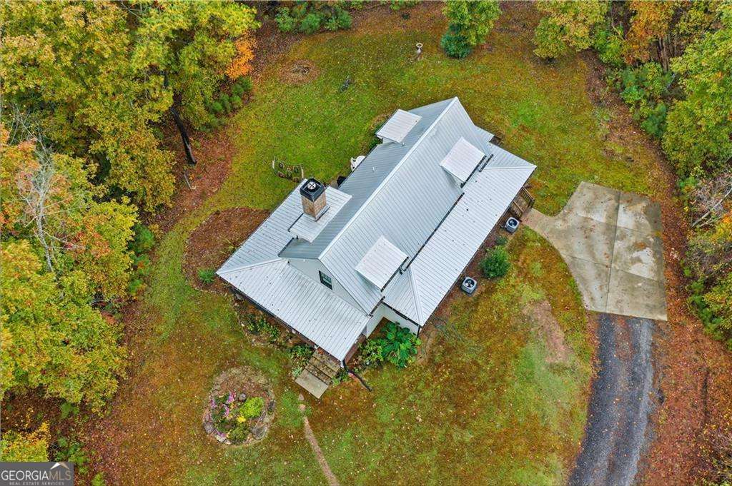 2197 Damascus Road Ball Ground, GA 30107 - Photo 10 of 39 an aerial view of house with yard swimming pool and outdoor seating