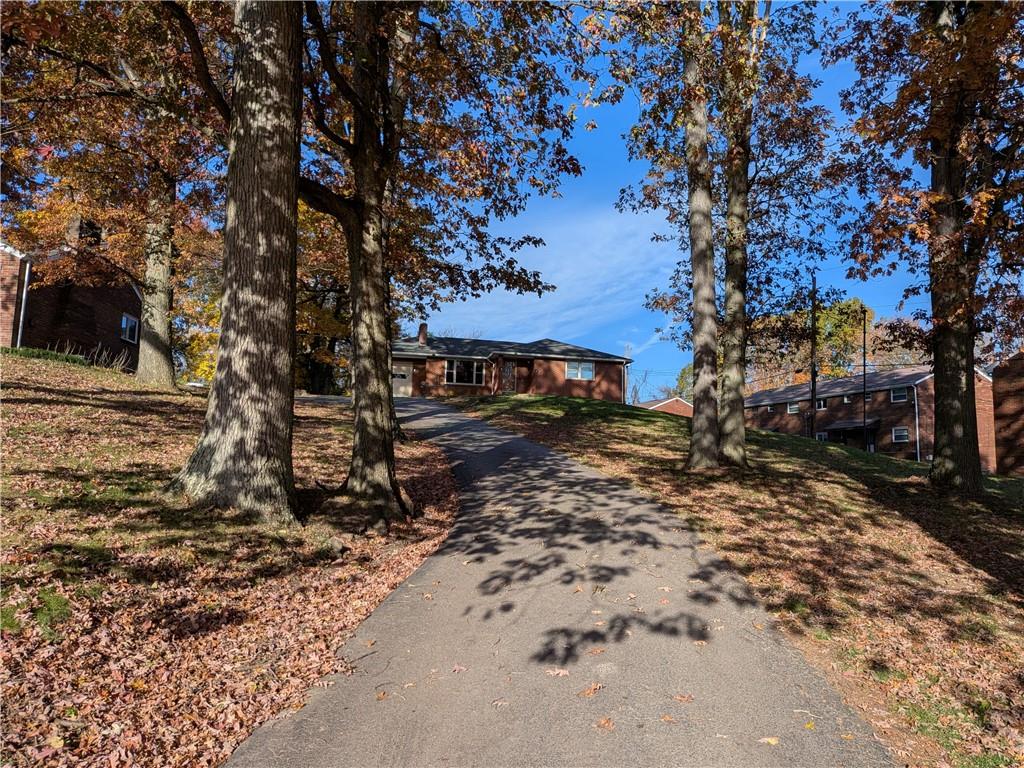 338 Moon Clinton Road Coraopolis, PA 15108 - Photo 2 of 13 a view of a backyard with large trees