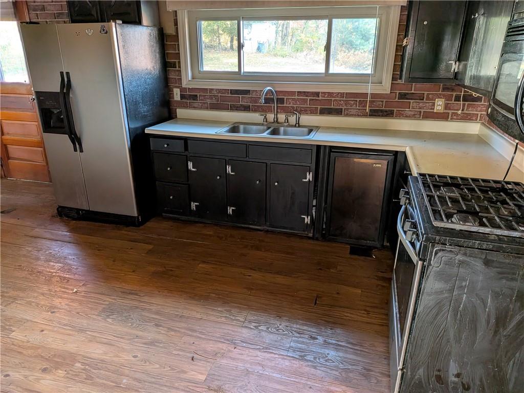 338 Moon Clinton Road Coraopolis, PA 15108 - Photo 8 of 13 a kitchen with stainless steel appliances granite countertop a refrigerator and a sink
