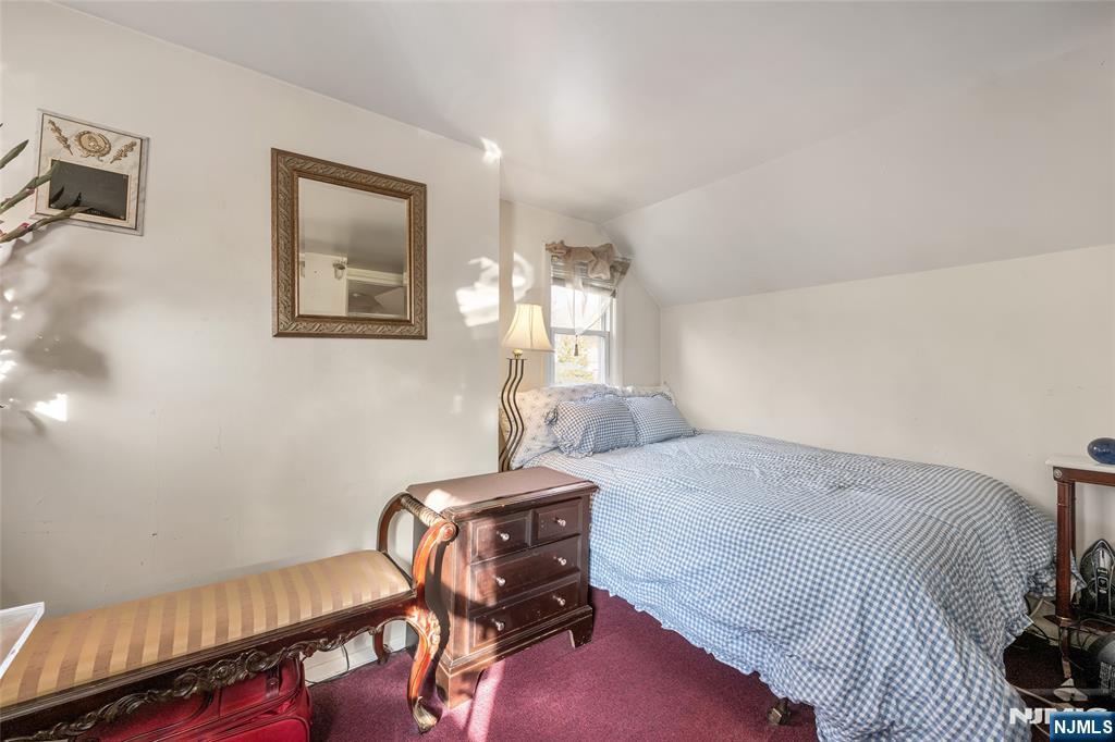 17 Porter Road West Orange, NJ 07052 - Photo 19 of 32 a bedroom with a bed and a table