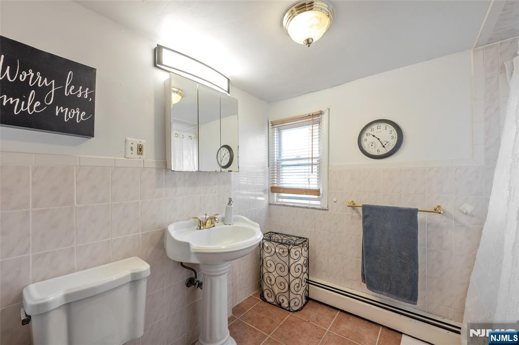17 Porter Road West Orange, NJ 07052 - Photo 21 of 32 a bathroom with a sink toilet and vanity