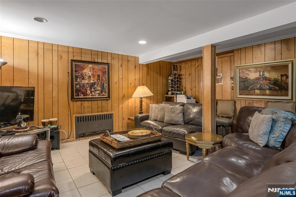 17 Porter Road West Orange, NJ 07052 - Photo 22 of 32 a living room with furniture and a flat screen tv