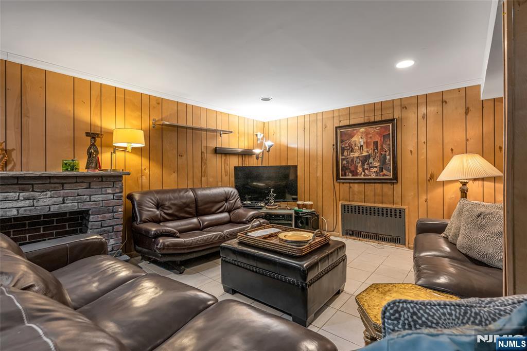 17 Porter Road West Orange, NJ 07052 - Photo 24 of 32 a living room with furniture and a fireplace