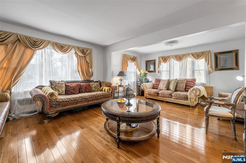 17 Porter Road West Orange, NJ 07052 - Photo 6 of 32 a living room with furniture a window and a lamp