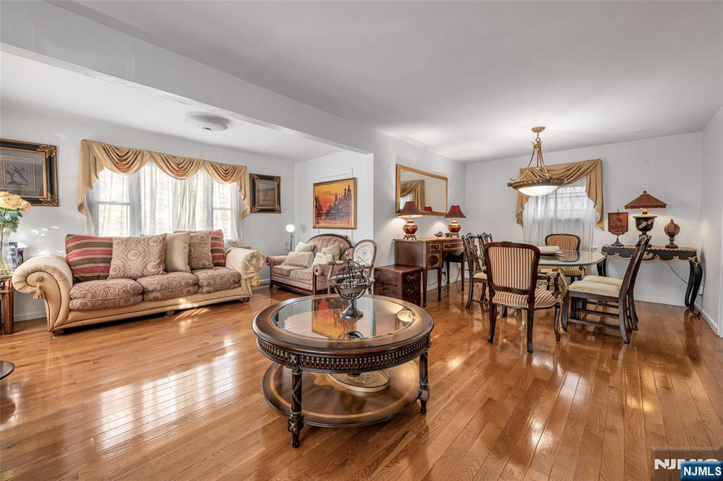 17 Porter Road West Orange, NJ 07052 - Photo 7 of 32 a living room with furniture a window and kitchen view