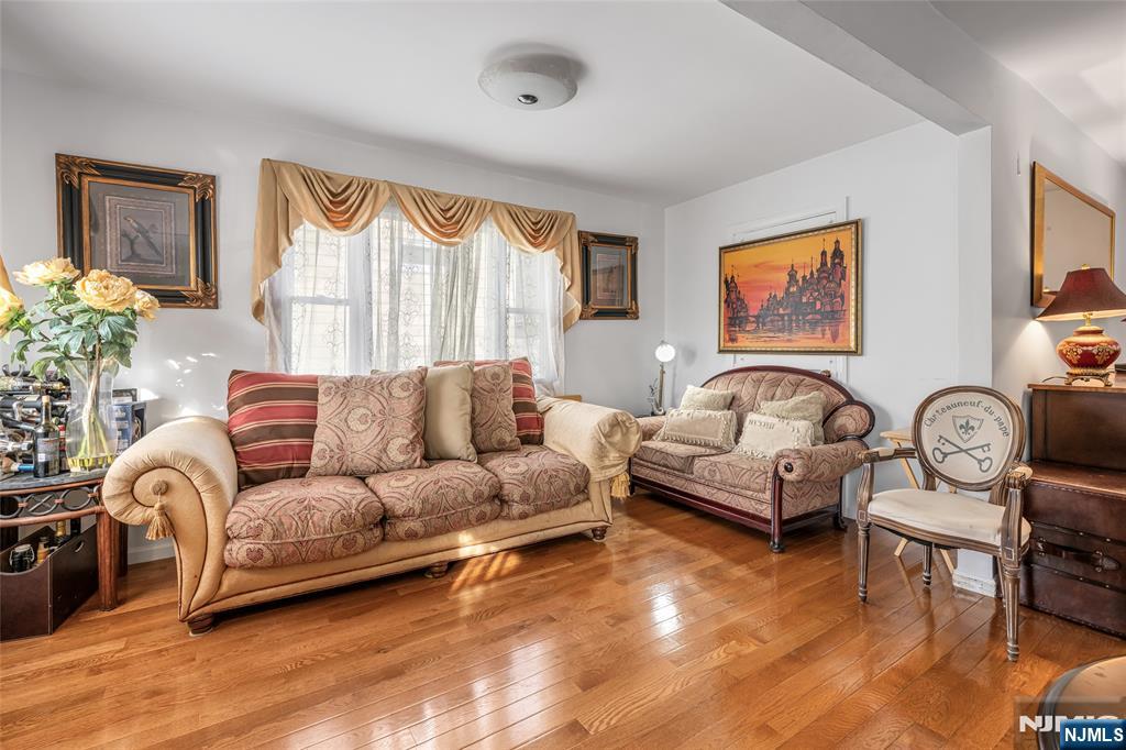 17 Porter Road West Orange, NJ 07052 - Photo 8 of 32 a living room with furniture and a large window