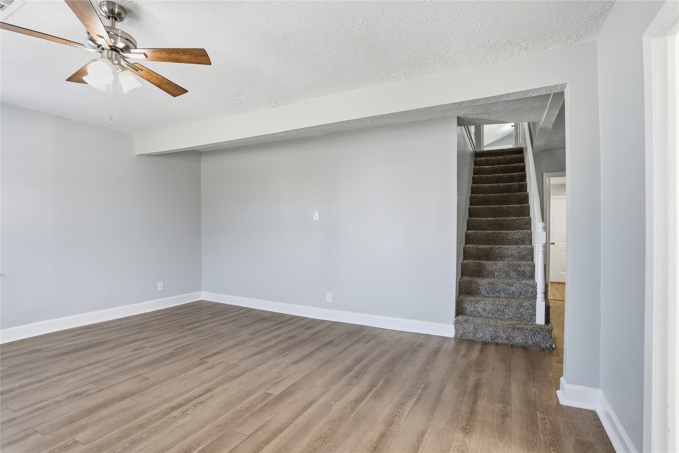 1707 Johnson Street Pasadena, TX 77502 - Photo 13 of 45 wooden floor in an empty room with a window