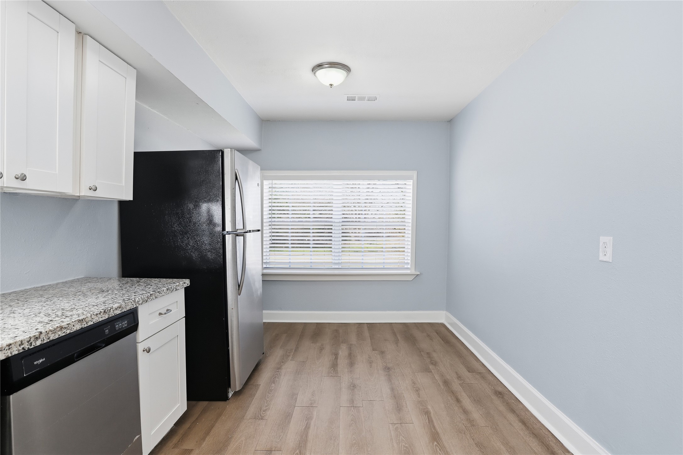 1707 Johnson Street Pasadena, TX 77502 - Photo 17 of 45 a kitchen with a refrigerator and a sink
