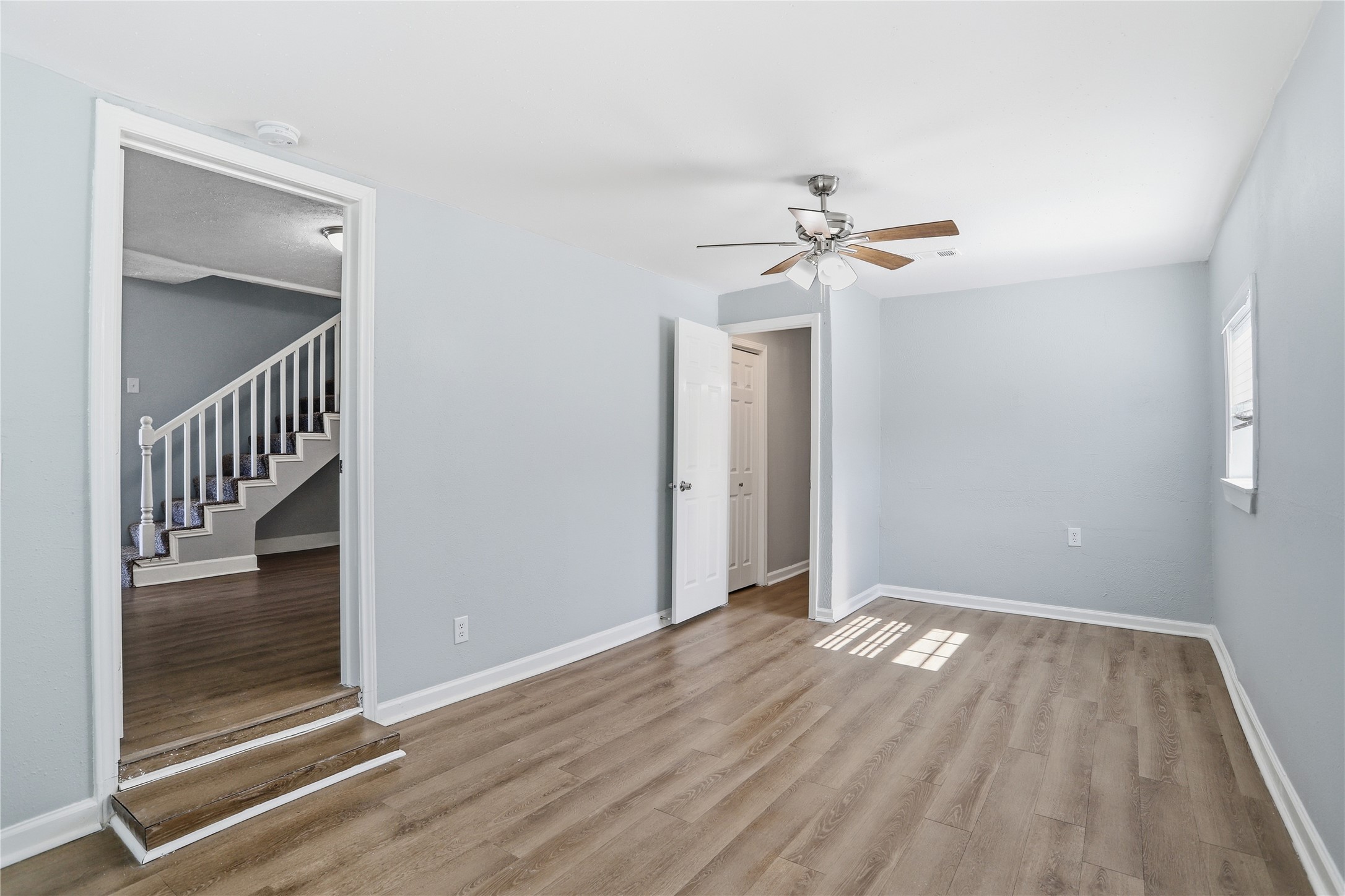 1707 Johnson Street Pasadena, TX 77502 - Photo 22 of 45 wooden floor in an empty room with a window