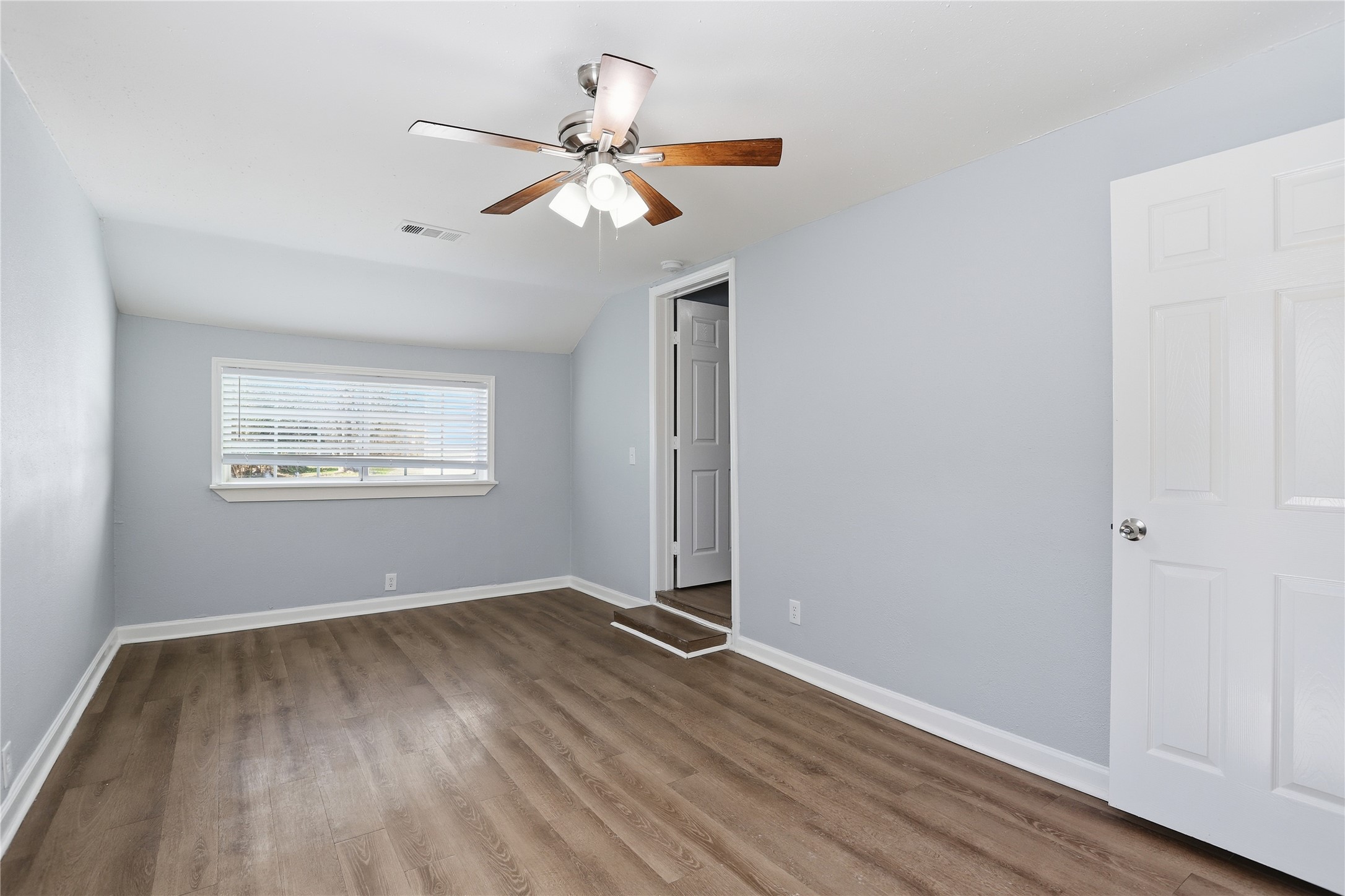 1707 Johnson Street Pasadena, TX 77502 - Photo 23 of 45 a view of an empty room with wooden floor and a window