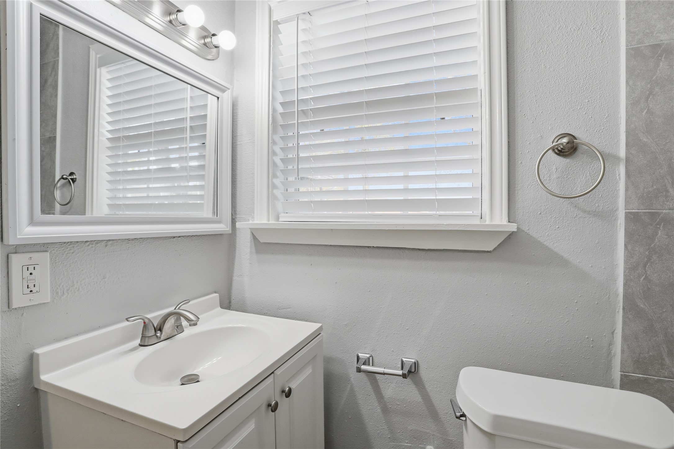 1707 Johnson Street Pasadena, TX 77502 - Photo 33 of 45 a bathroom with a sink a toilet and a mirror