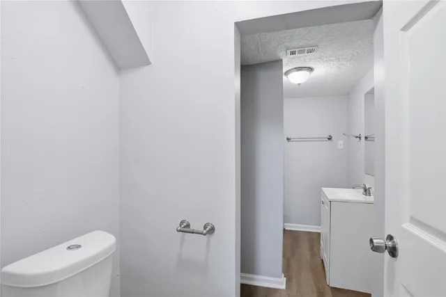 a bathroom with a toilet and a sink