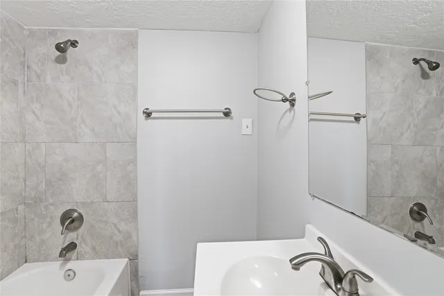 a bathroom with a sink and a tub