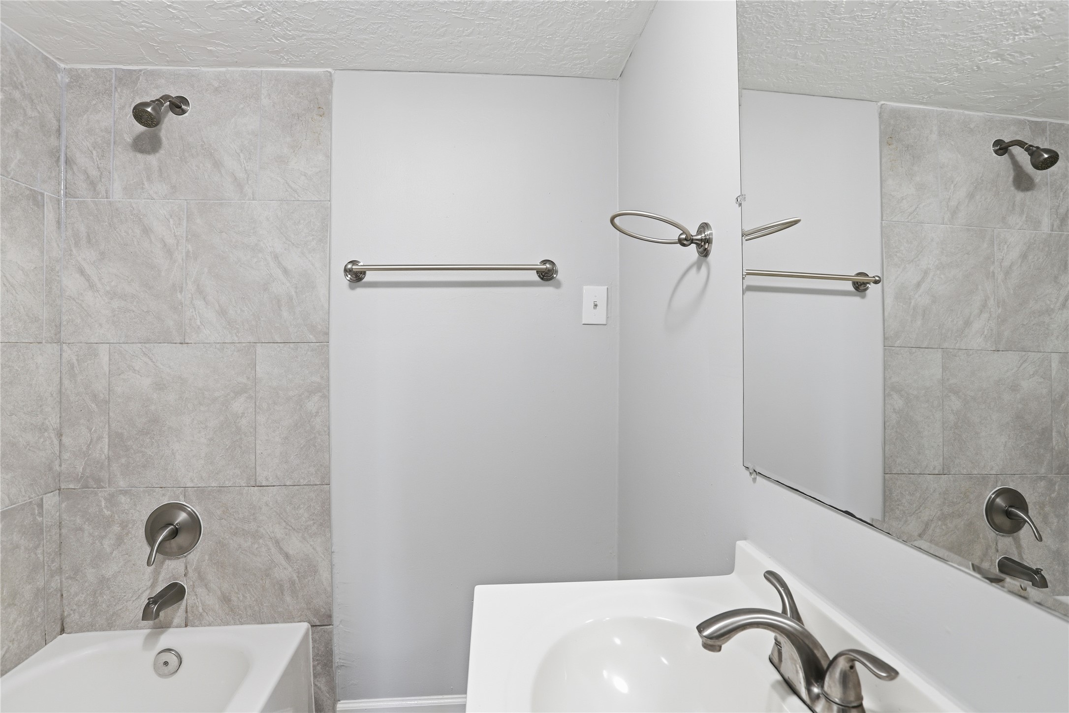 1707 Johnson Street Pasadena, TX 77502 - Photo 35 of 45 a bathroom with a sink and a tub