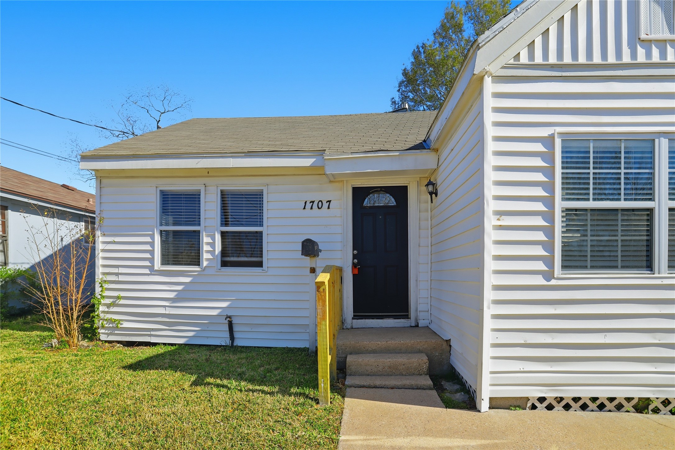 1707 Johnson Street Pasadena, TX 77502 - Photo 4 of 45 a view of a house with large windows and a stairs