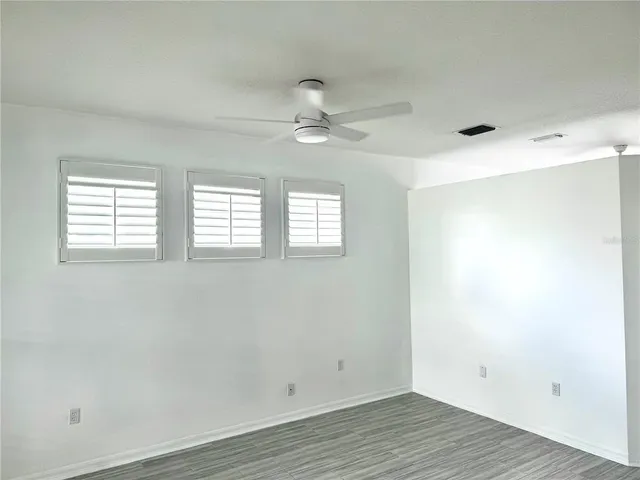 a view of a small space with wooden floor