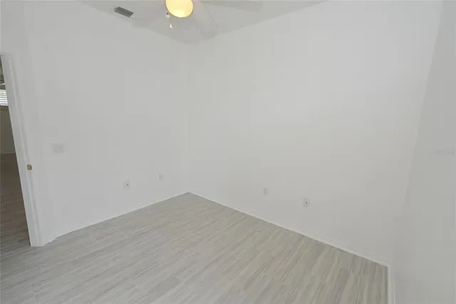 a view of a small space with wooden floor