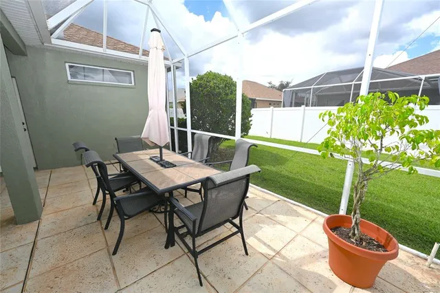a living room with a table and chairs