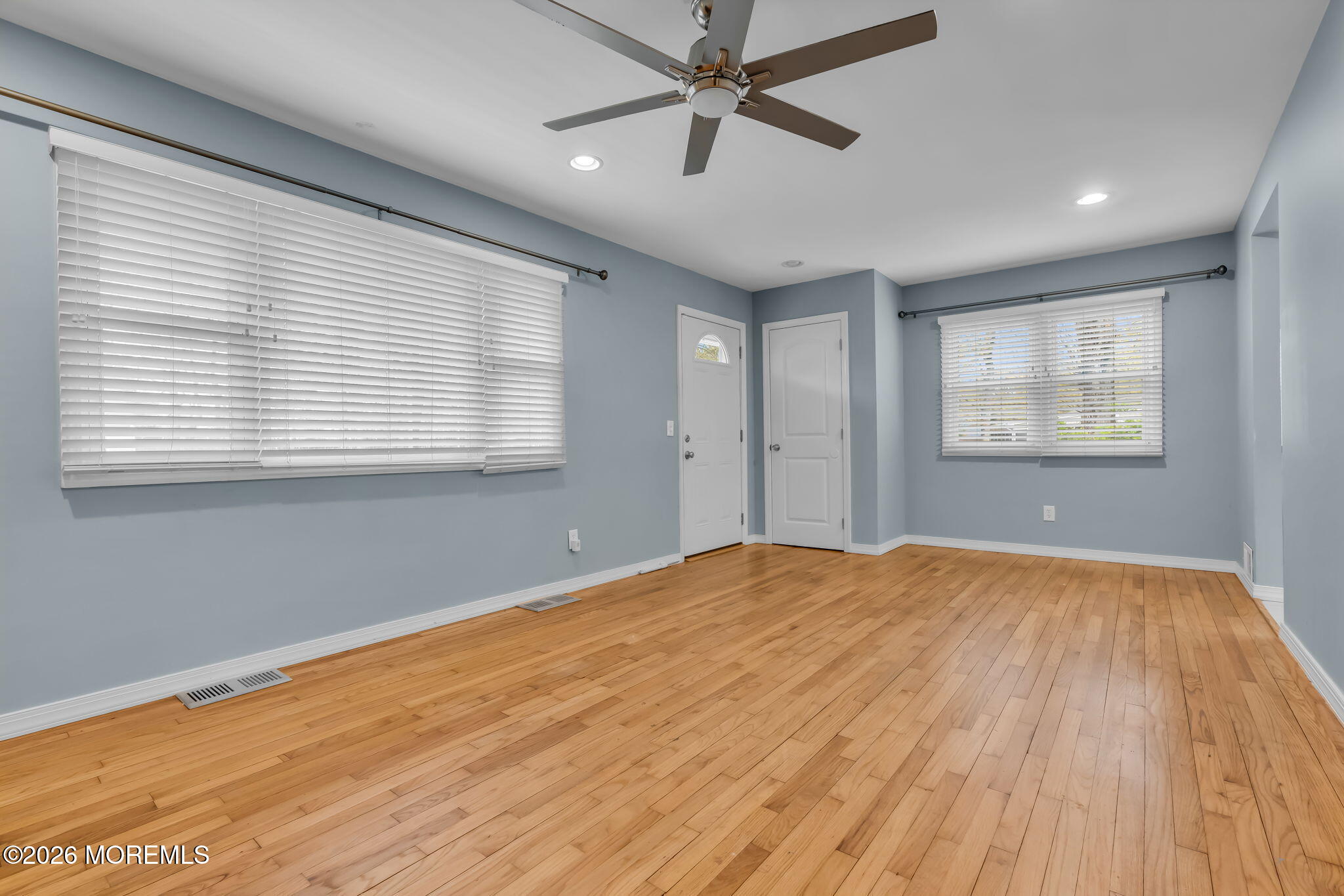 593 Beach Plum Road Brick, NJ 08723 - Photo 25 of 38 a view of an empty room with wooden floor and a window
