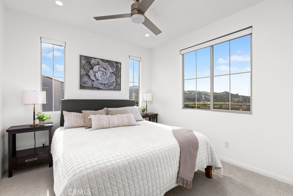 663 Longhorn Way Rancho Mission Viejo, CA 92694 - Photo 19 of 52 a bedroom with a large bed and a window
