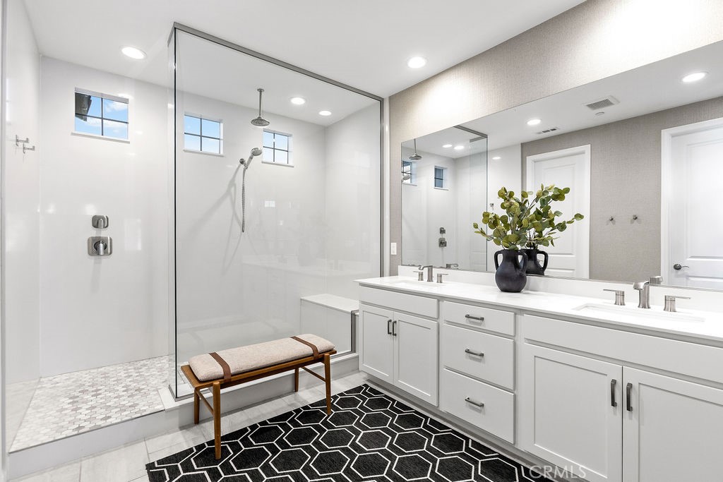 663 Longhorn Way Rancho Mission Viejo, CA 92694 - Photo 27 of 52 a bathroom with a double vanity sink mirror and shower