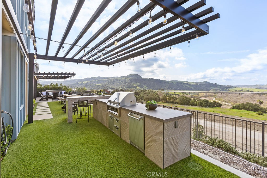 663 Longhorn Way Rancho Mission Viejo, CA 92694 - Photo 32 of 52 a view of a terrace with open kitchen