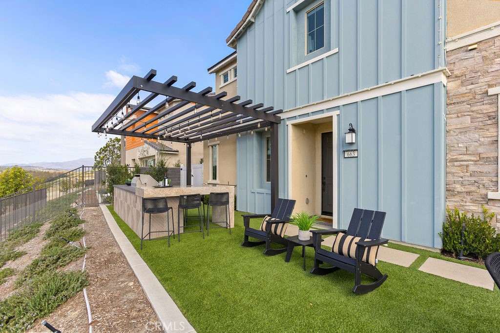 663 Longhorn Way Rancho Mission Viejo, CA 92694 - Photo 33 of 52 a view of a chairs and table in backyard of the house