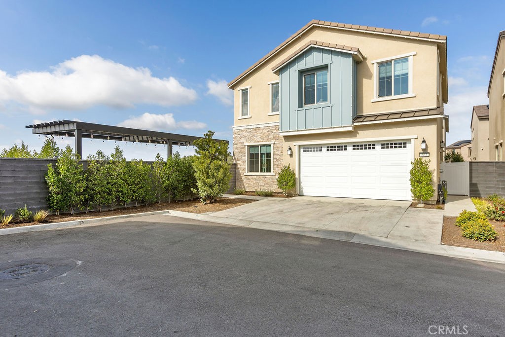 663 Longhorn Way Rancho Mission Viejo, CA 92694 - Photo 44 of 52 a front view of a house with a yard and garage