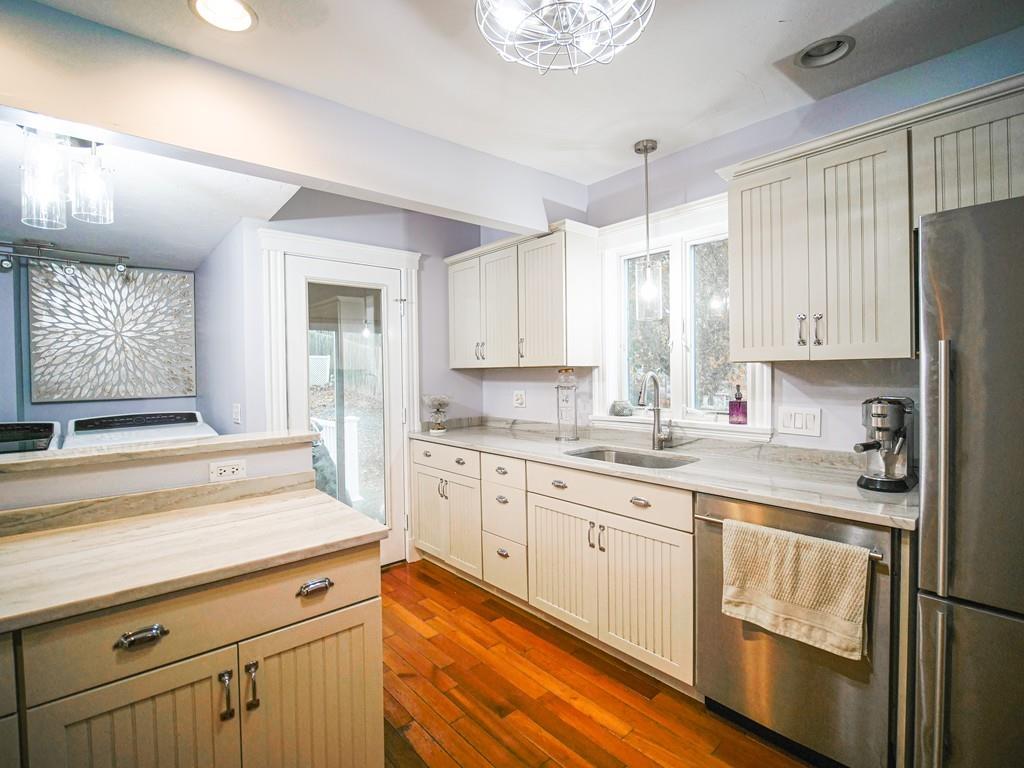 26 Edgehill Road Braintree, MA 02184 - Photo 2 of 27 a kitchen with stainless steel appliances granite countertop a sink and cabinets