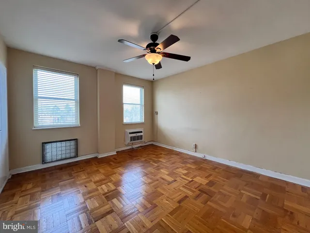 a view of an empty room with a window