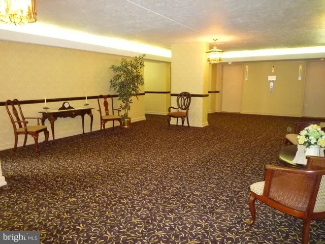 a view of a lobby with wooden floor