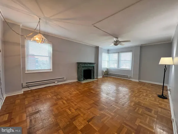 a view of an empty room with a window