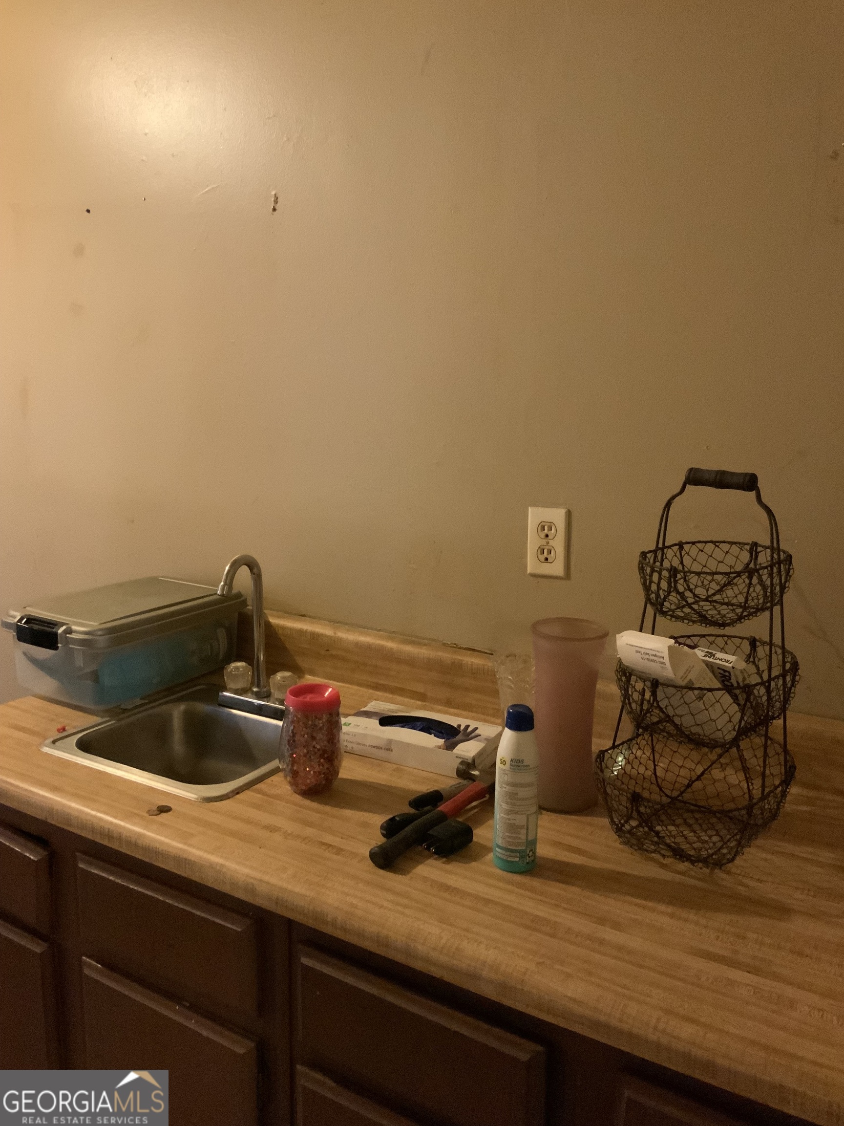10065 Brass Ring Road Jonesboro, GA 30238 - Photo 26 of 48 a kitchen with a sink and cabinets