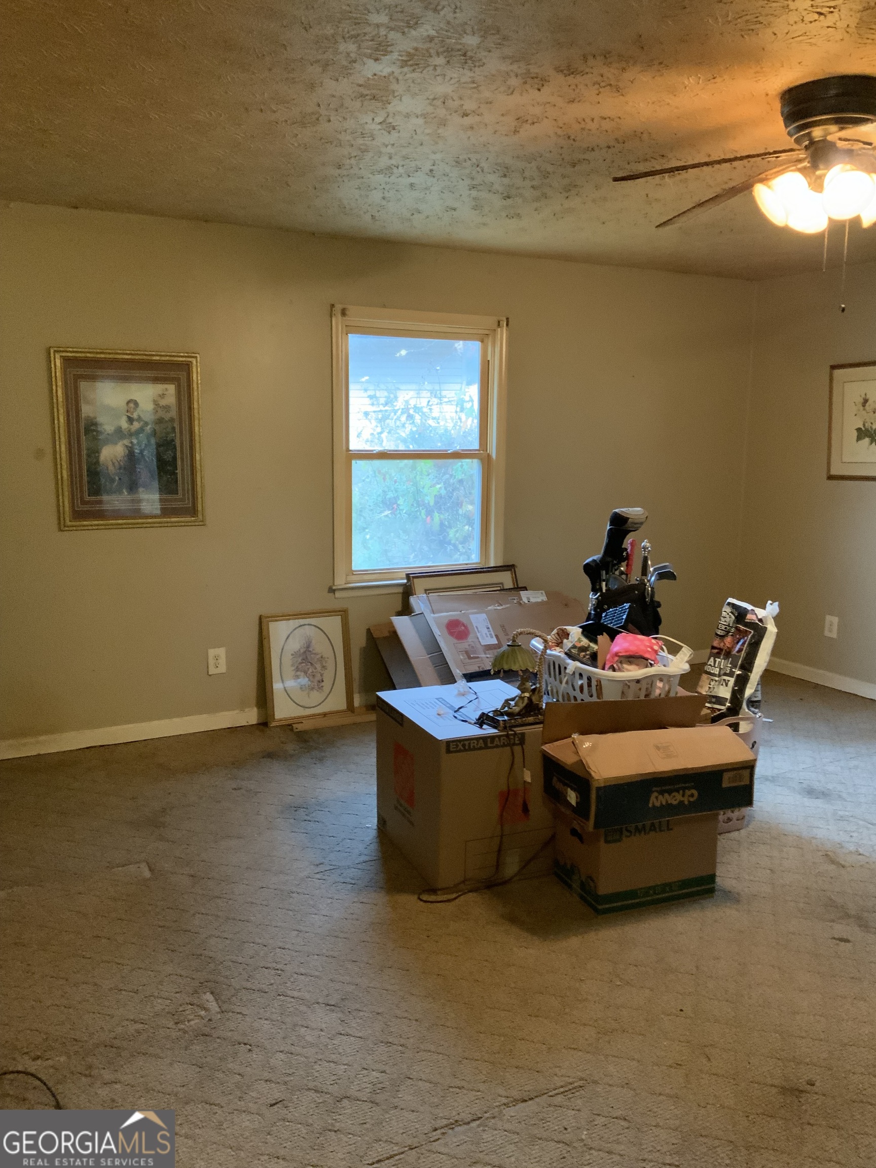 10065 Brass Ring Road Jonesboro, GA 30238 - Photo 30 of 48 a living room with furniture and a window